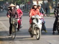 Asian motorbike and bicycle traffic on the street