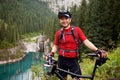 Asian mountain biker and lake