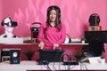 Asian musician performing electronic sound at professional turntables in studio