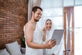 Asian muslim couple hajj using tablet