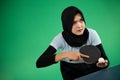 Asian Muslim female athlete preparing to serve Royalty Free Stock Photo