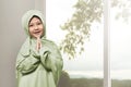 Asian muslim girl wearing hijab praying Royalty Free Stock Photo