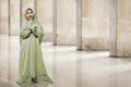 Asian muslim kid in green hijab clothes praying Royalty Free Stock Photo