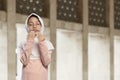 Asian muslim kid in hijab praying to god Royalty Free Stock Photo