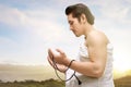 Asian Muslim man in ihram clothes praying with prayer beads on his hands Royalty Free Stock Photo