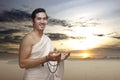 Asian Muslim man in ihram clothes praying with prayer beads on his hands Royalty Free Stock Photo