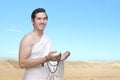 Asian Muslim man in ihram clothes praying with prayer beads on his hands Royalty Free Stock Photo
