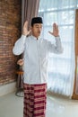 Asian muslim man solat and takbir Royalty Free Stock Photo