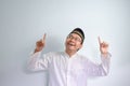 Asian Muslim man wearing glasses and white cloth smiling pose for ramadhan