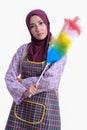Asian Muslim wearing apron and hold a cleaner