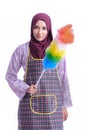 Asian Muslim wearing apron and hold a cleaner