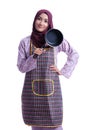 Asian Muslim wearing apron and hold a cooking