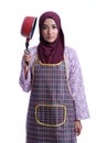 Asian Muslim wearing apron and hold a cooking