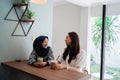 Asian muslim woman bestfriend together in cafe