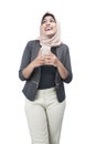 Asian Muslim woman in a headscarf holding a mobile phone Royalty Free Stock Photo
