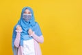 Asian muslim woman in medical mask Coronavirus pandemic disease smiling and greeting isolate background. COVID-19 virus epidemic o Royalty Free Stock Photo