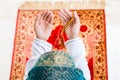 Asian Muslim woman praying with beads chain Royalty Free Stock Photo