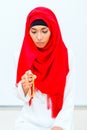 Asian Muslim woman praying with beads chain Royalty Free Stock Photo