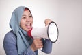 Asian muslim woman Shouting with Megaphone, Leader, Supporter or Protester Royalty Free Stock Photo