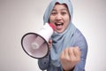 Asian muslim woman Shouting with Megaphone, Leader, Supporter or Protester Royalty Free Stock Photo