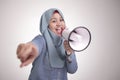 Asian muslim woman Shouting with Megaphone, Leader, Supporter or Protester Royalty Free Stock Photo