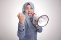 Asian muslim woman Shouting with Megaphone, Leader, Supporter or Protester Royalty Free Stock Photo