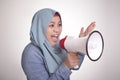 Asian muslim woman Shouting with Megaphone, Leader, Supporter or Protester Royalty Free Stock Photo