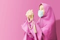 Asian Muslim woman in a veil and wearing flu mask praying with prayer beads Royalty Free Stock Photo