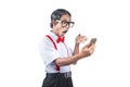 Asian nerd with an ugly face holding mobile phone with shocked expression Royalty Free Stock Photo