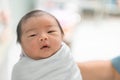 Asian newborn baby in  bassinet at delivery room at hospital Royalty Free Stock Photo