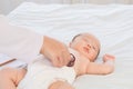 Asian newborn baby get sick sleep during examine by pediatrician doctor hand hold stethoscope, Little child in medicine hospital.