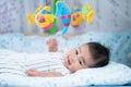 Asian newborn baby smile in a bed