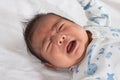 asian newborn crying on white towel Royalty Free Stock Photo