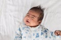 Asian newborn crying on white towel Royalty Free Stock Photo