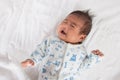 Asian newborn crying on white towel Royalty Free Stock Photo