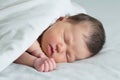 Asian newborn sleeping under white blanket, asian baby portrait