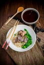 Asian noodle soup with beef meatball with fresh vegetable on woo Royalty Free Stock Photo