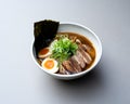 Asian noodle soup, ramen with meat, tofu, vegetables, nori and egg in white bowl Royalty Free Stock Photo