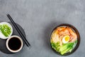 Asian noodle soup, ramen with prawn shrimp, vegetables and egg in black bowl on gray concrete background. Flat lay, Top view, mock Royalty Free Stock Photo