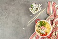 Asian noodles with chicken, vegetables, and herbs in a red bowl. Traditional Japanese soup Royalty Free Stock Photo