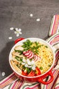 Asian noodles with chicken, vegetables, and herbs in a red bowl. Traditional Japanese soup Royalty Free Stock Photo