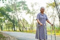 Asian nurse physiotherapist doctor care, help and support senior or elderly old lady woman patient walk with walker at hospital. Royalty Free Stock Photo