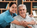 Asian nurse, senior man and hug in portrait with support, empathy and nursing home care for retirement. Doctor, elderly Royalty Free Stock Photo