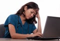 Asian nurse tired working on laptop Royalty Free Stock Photo