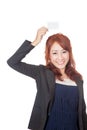 Asian office girl happy show blank card over her head