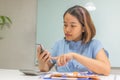 Asian office woman check her text message on smartphone Royalty Free Stock Photo