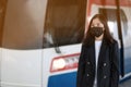 asian office women with face mask in train station Royalty Free Stock Photo