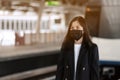 asian office women with face mask in train station Royalty Free Stock Photo