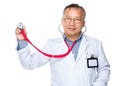 Asian old doctor hold with stethoscope Royalty Free Stock Photo