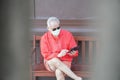 Asian old elder senior man wearing face mask elderly using mobile smart phone cellphone. mature retirement lifestyle Royalty Free Stock Photo